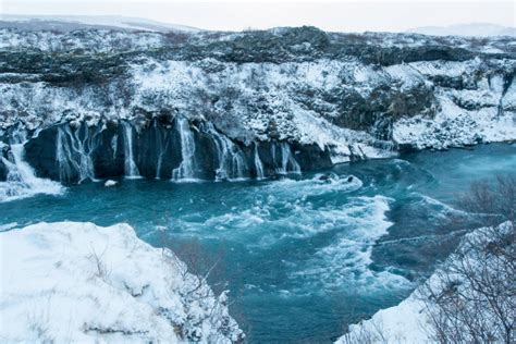 Hraunfossar appear from the lava field Hallmundarhraun