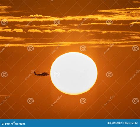 Helicopter Silhouette on Vibrant Sunset Sky. Stock Photo - Image of ...