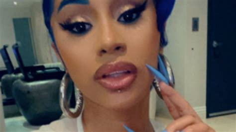 Cardi B rocks blue eyebrows while getting new piercings | MamasLatinas.com