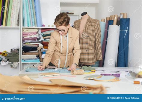 Tailor making clothes stock image. Image of eyeglasses - 182754659