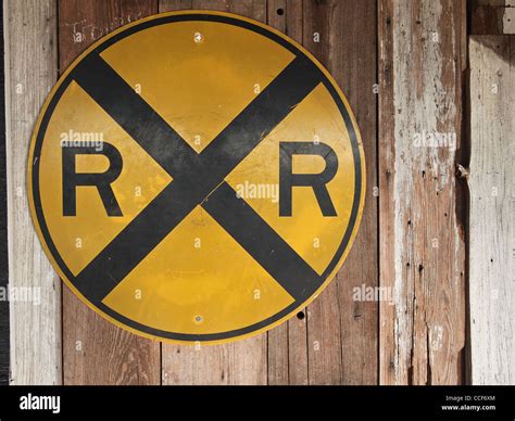 yellow Railroad Crossing sign Stock Photo - Alamy