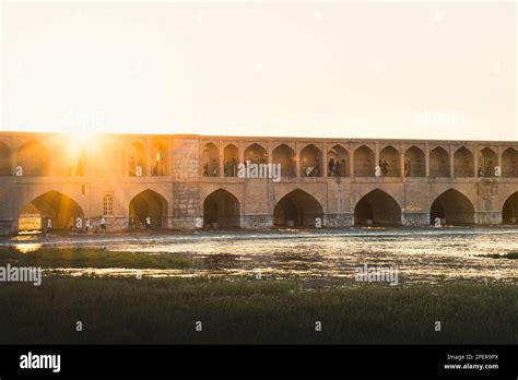 Isfahan, Iran - May 2022: people chill and socialize around SioSe Pol ...