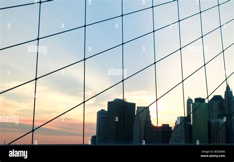 The statue of Liberty and Manhattan from Brooklyn bridge Stock Photo ...