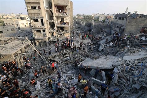 ‘The whole building fell on us’: Blast at refugee camp in central Gaza ...