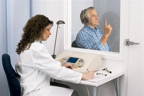 Testing in a booth - Anitech Audiometric testing | Onsite Hearing test ...