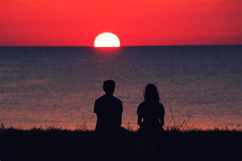 Two person watching the sunset 1864723 Stock Photo at Vecteezy