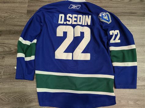 Urban Auctions - CANUCKS DANIEL SEDIN JERSEY