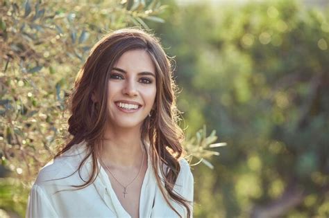 Premium Photo | Smiling woman standing in nature