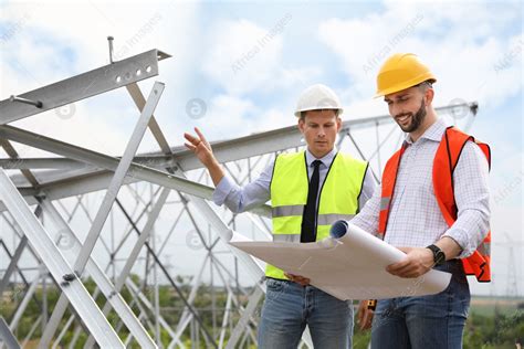 Professional engineers working on installation of electrical substation outdoors: Stock Photo ...