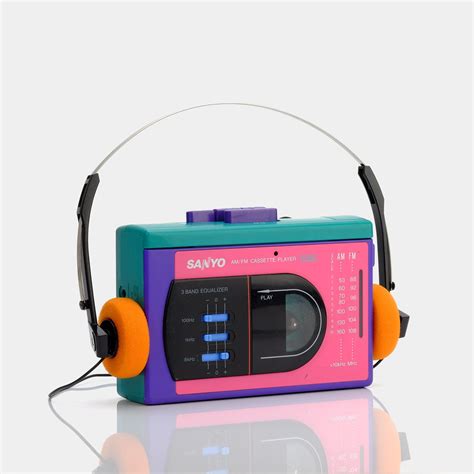 A Sanyo AM/FM cassette player with and retro orange headphones. Take a ...