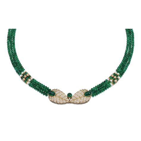 EMERALD BEAD AND DIAMOND NECKLACE -- Designed as three rows of emerald beads set at intervals ...