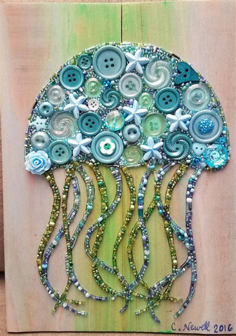 an art piece made out of buttons and beads on a wooden board with a button tree in the middle