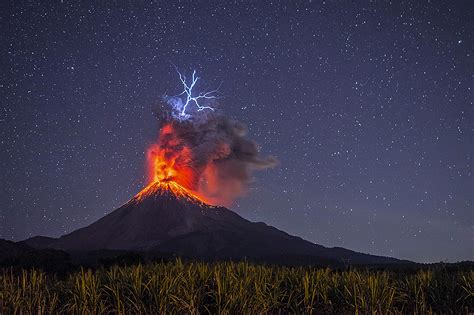 Incredible image captures moment lightning struck an erupting volcano ...