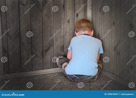 Sad Little Boy Sitting in the Corner Turned His Back. Stock Image ...