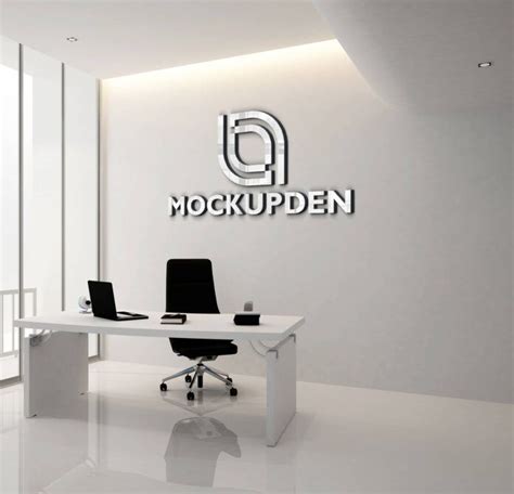 an office with a white desk and black chairs in front of the logo on the wall