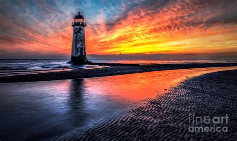 Sunset Lighthouse Photograph by Adrian Evans - Pixels