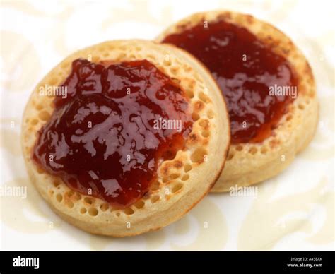 Crumpets with Strawberry Jam Stock Photo - Alamy