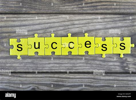 Puzzle pieces with word Success Stock Photo - Alamy