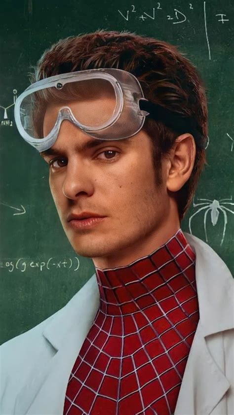 a man with glasses and a tie in front of a blackboard