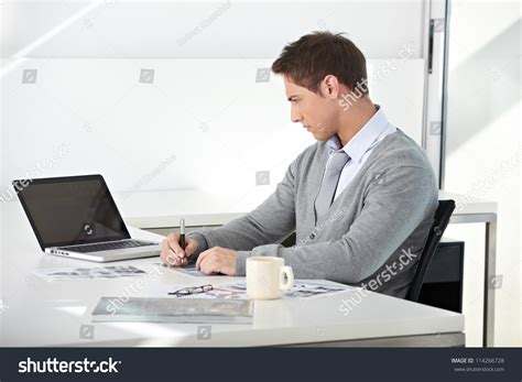 Creative Student Working With His Laptop At Desk Stock Photo 114266728 : Shutterstock