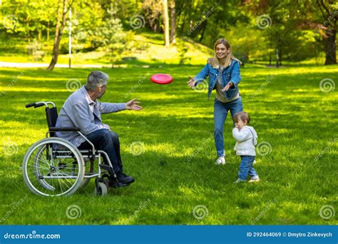 Cute Family Playing Frisbee in the Park Stock Image - Image of child ...