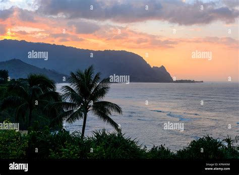 Sunset at Hanalei Bay - A colorful sunset view of the misty Hanalei Bay ...