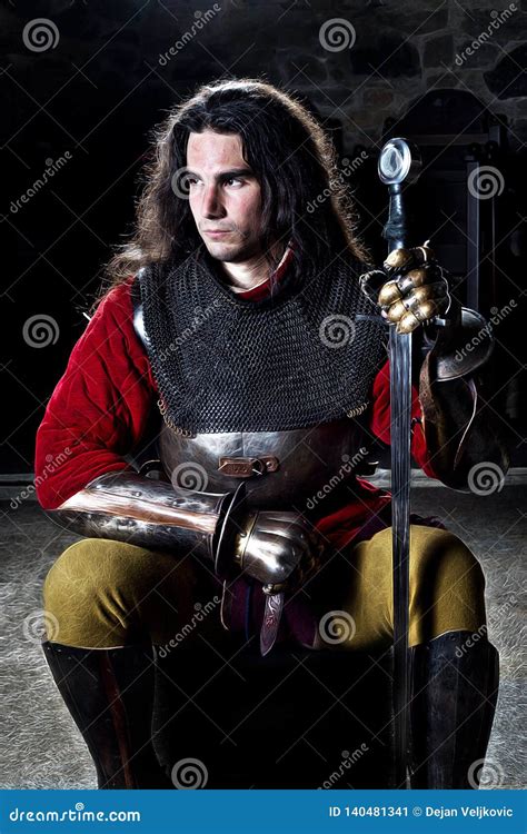 Portrait of Brave Knight with Sword Against Stonewall Stock Image ...