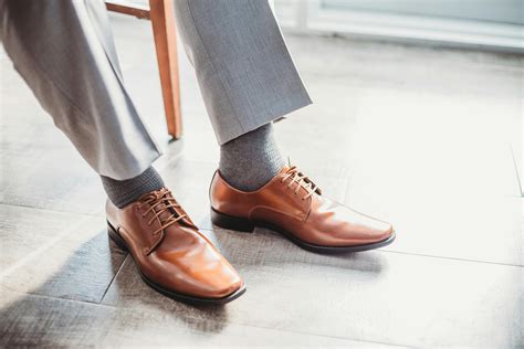 Person Sitting and Wearing Dress Pants and Shoes · Free Stock Photo