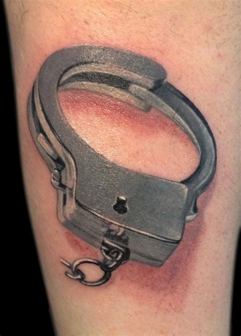 handcuffs by Michele Pitacco: TattooNOW