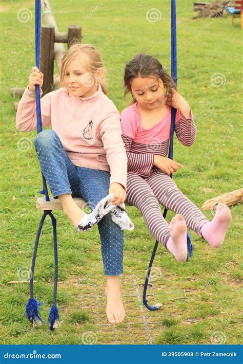 Two girls on swing stock photo. Image of sister, nice - 39505908