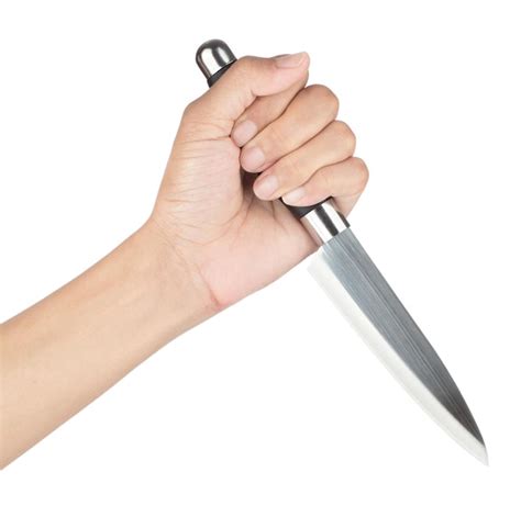 Premium Photo | Hand holding kitchen knife isolated on white background