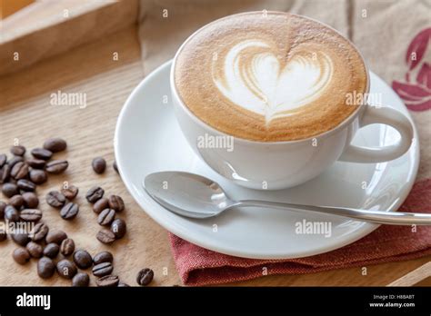 Coffee cup of Cafe' latte with heart latte art on top Stock Photo - Alamy