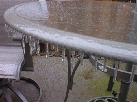 Patio table covered in a sheet of ice | David Sinclair | Flickr