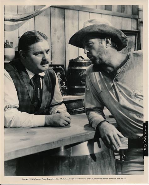 Robert Mitchum, with his younger brother, John Mitchum (on the left) in the 1967 Western movie ...