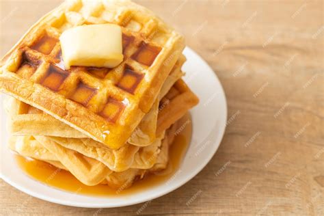 Premium Photo | Waffle stack with butter and honey