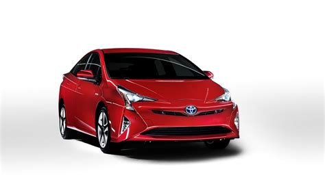 2016 Toyota Prius front three quarter view red North American specification official image