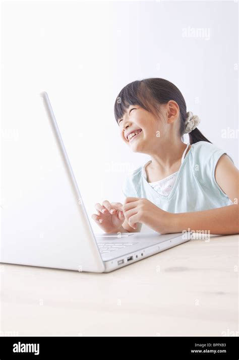 Girl studying with a laptop computer Stock Photo - Alamy