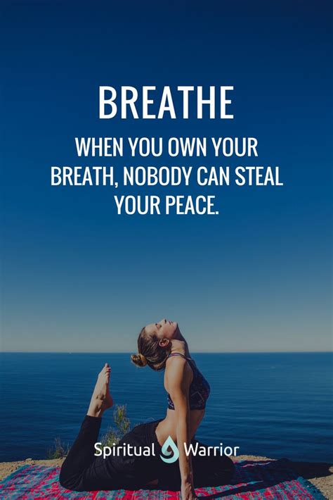 a woman doing yoga on a rug with the quote breathe when you own your ...