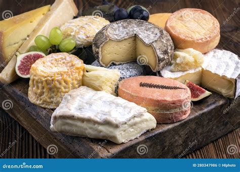 Traditional Party Platter with Soft Cheese and Fruits on a Rustic Wooden Design Board Stock ...