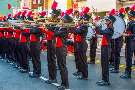 Boy in Marching Band Uniform Playing Trumpet · Free Stock Photo