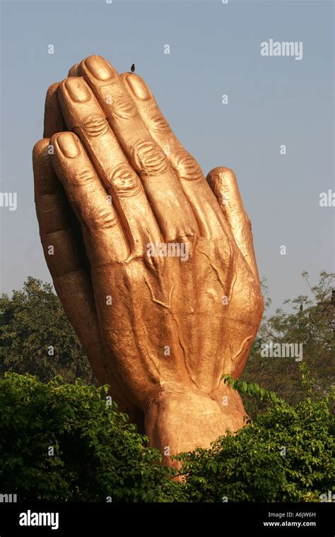 Golden "Namaste" Hands sculpture near the Gandhi Ashram in Ahmedabad ...