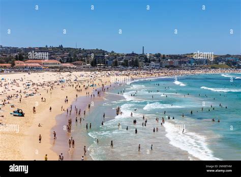 Bondi beach Sydney Australia, crowded bondi beach in summer 2023, beachgoers sunbathe and swim ...