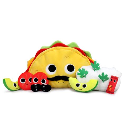 a taco stuffed animal sitting on top of a pile of other plush toy animals