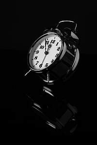 Royalty-Free photo: White and black table alarm clock | PickPik