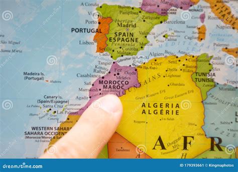 Finger Pointing To a Colorful Country Map in English and French of Morocco in North Africa ...