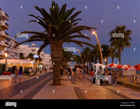 Portugal, the Algarve, Quarteira promenade at dusk Stock Photo - Alamy