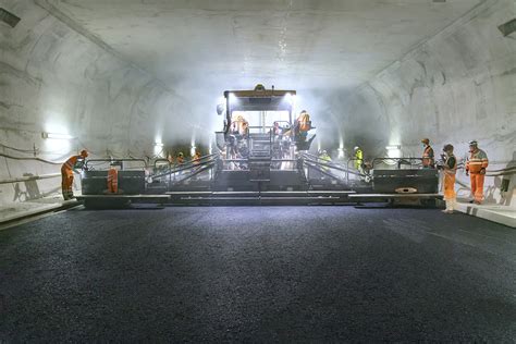 Vögele | Smart road construction in the widest tunnel in Switzerland ...