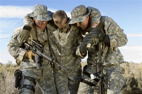 US Army Soldier Carrying Wounded Colleague Stock Photo - Image of army ...