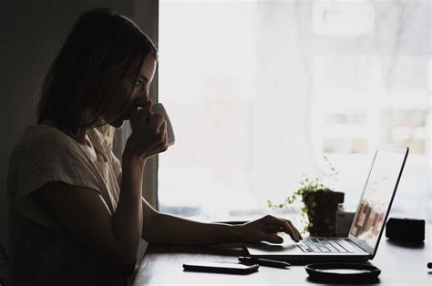 Woman Drinking Coffee Laptop Royalty Free Photo