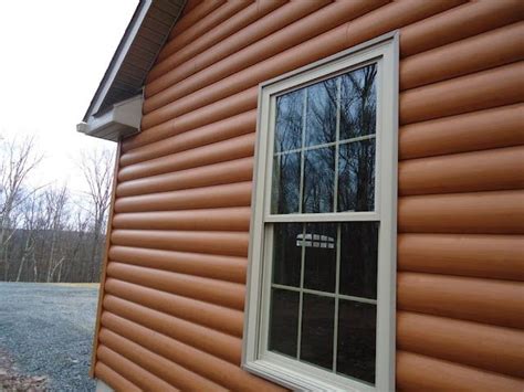 Close-up of the side of Timbermill (Vinyl) Simulated Cedar Siding: Log Profile: American Cedar ...